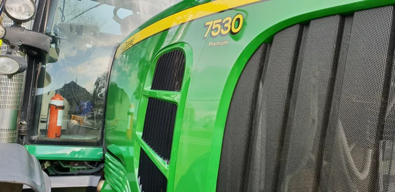 Green tractor after Nano-Clear rejuvenation, showing restored vibrant green paint and a high-gloss protective coating for long-lasting agricultural machinery protection.