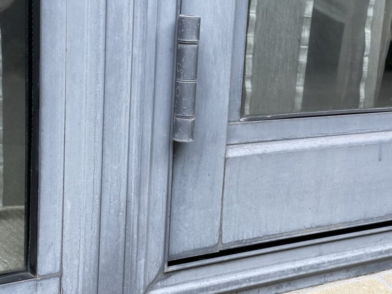 Faded powder-coated aluminium joinery before rejuvenation