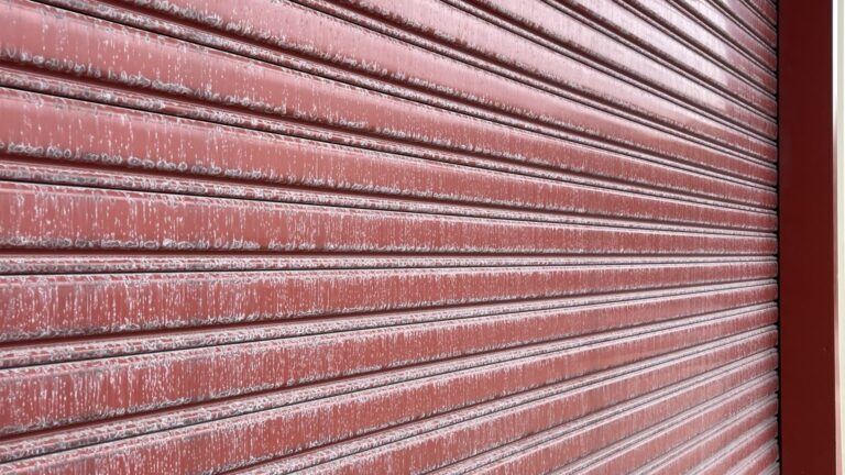 Faded commercial roller door before Nano-Clear rejuvenation